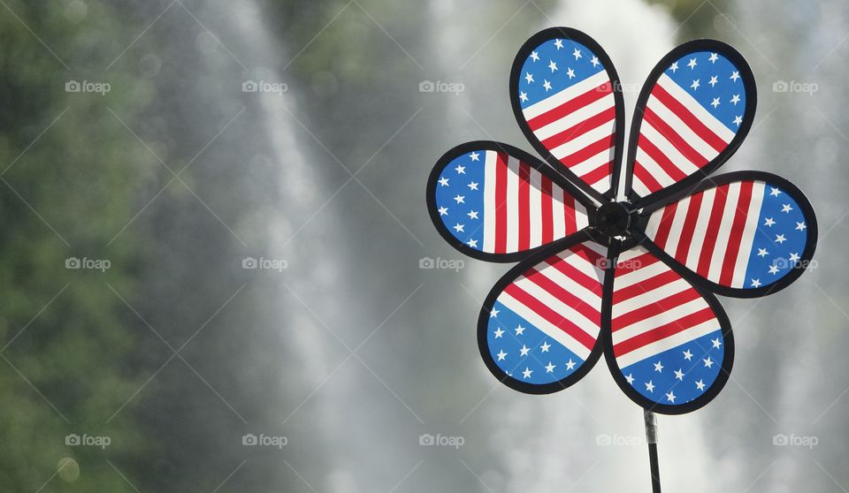 Patriotic Pinwheel with a fountain spraying water in the background