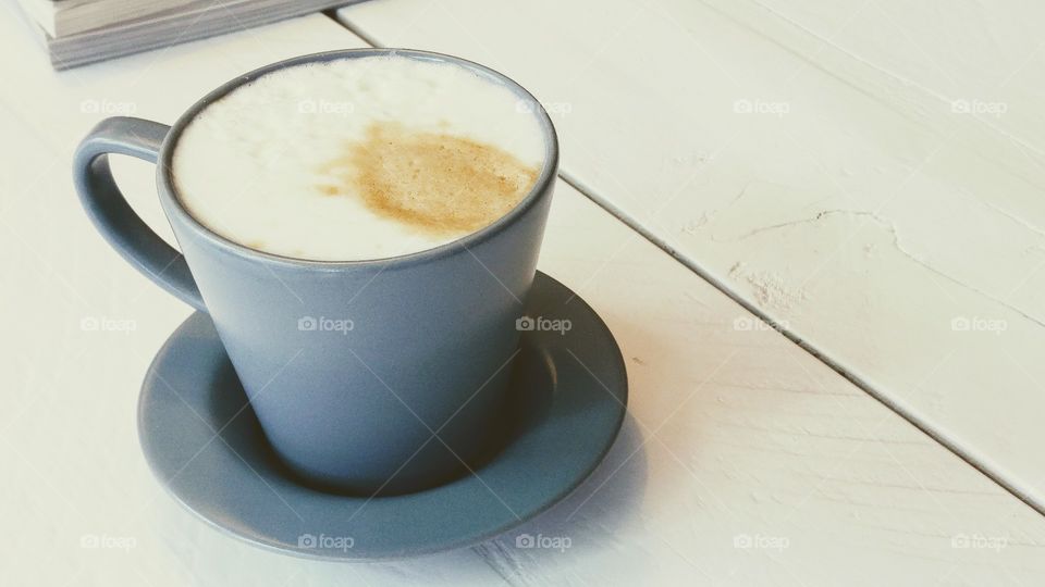 vintage cup of coffee on a white wooden table