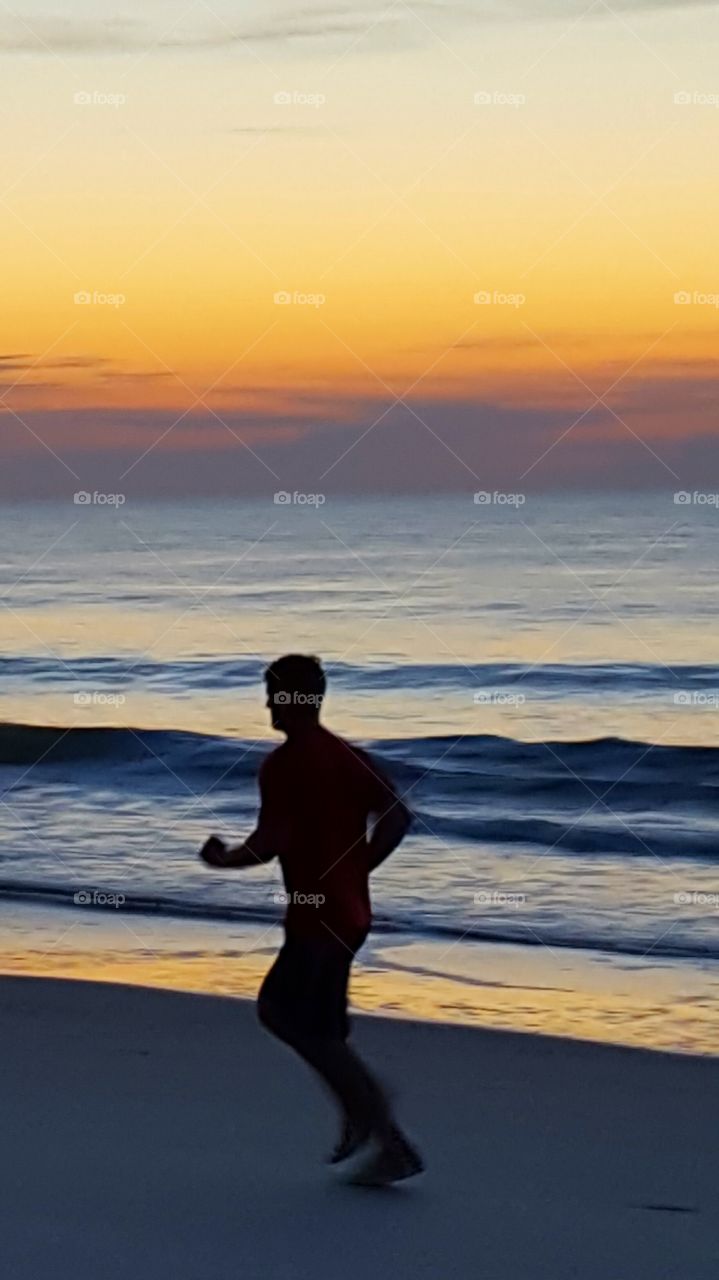 jog on the beach at sunrise