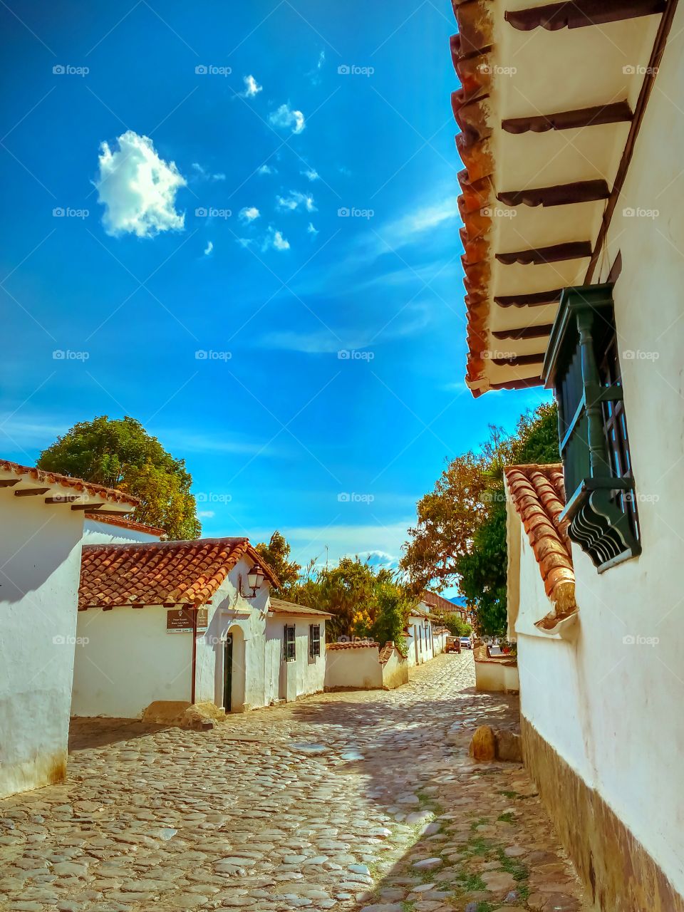 Villa de Leyva street, Colombia on a clear blue sky day without people. Calle de Villa de Leyva, Colombia en un día de cielo azul despejado sin gente. Boyacá, Colombia.