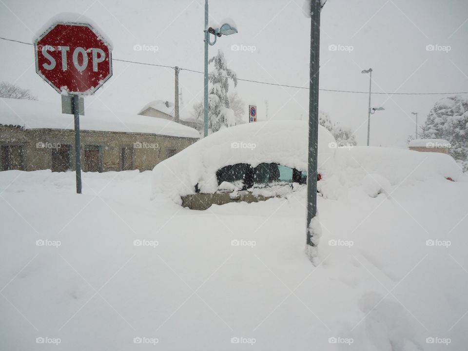 CAR covered under the snow. Big one snow in North Italy