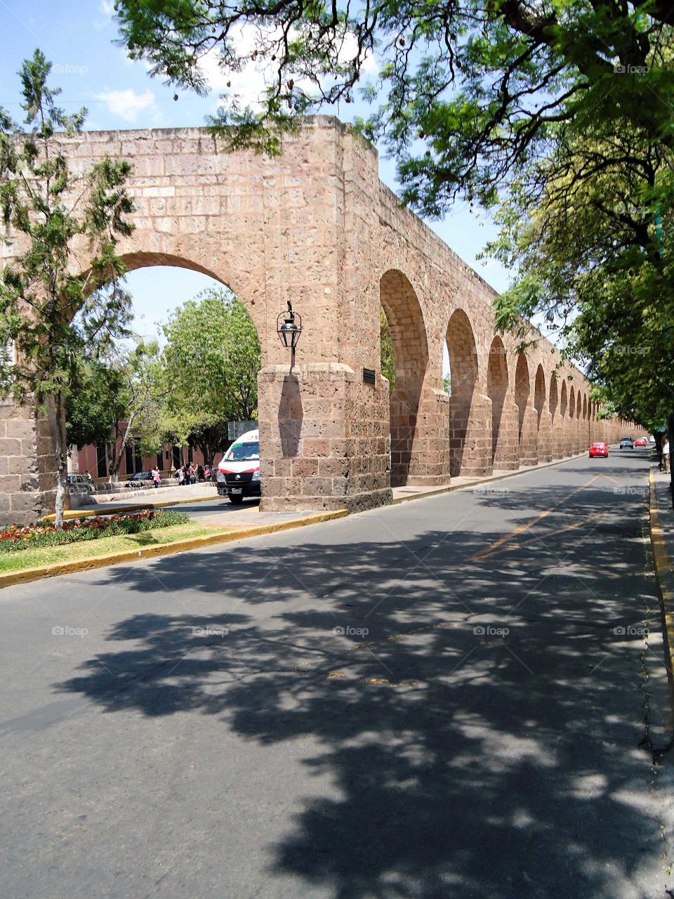 old meets new: an ancient aqueduct and city streets