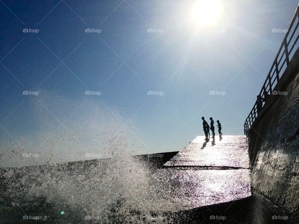 Silhouettes above the waves