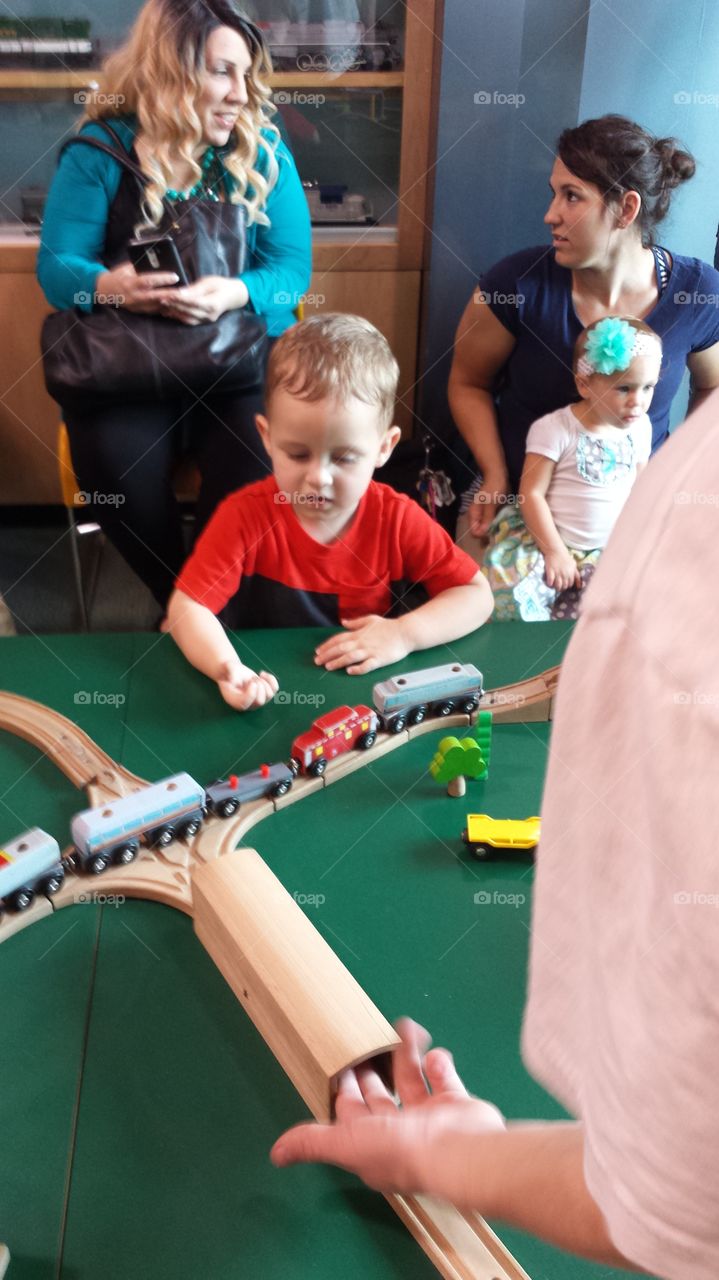Sheer joy. This photo is of a young man that is very elated with anything trains.