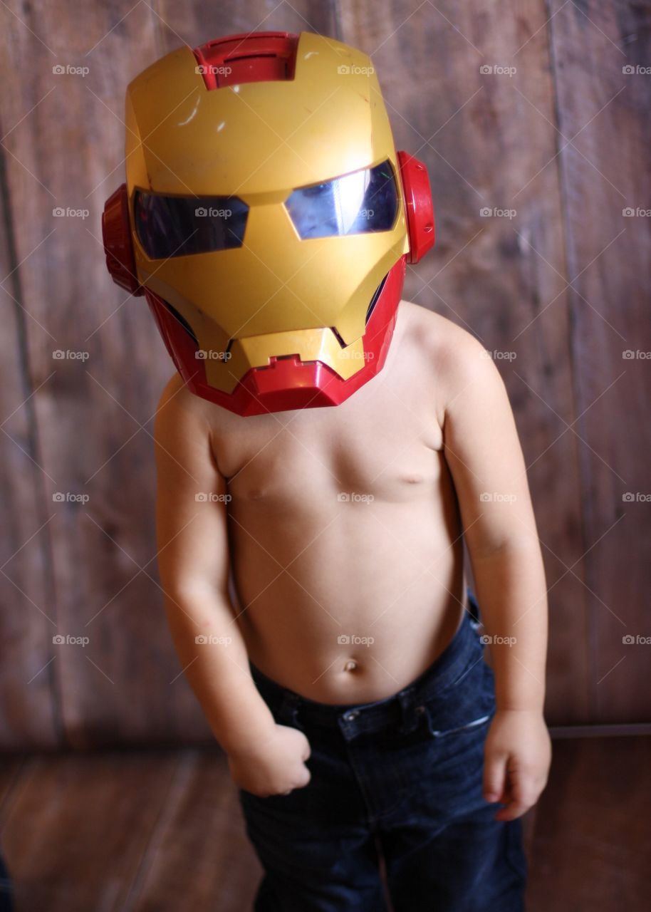 Little boy wearing steel helmet