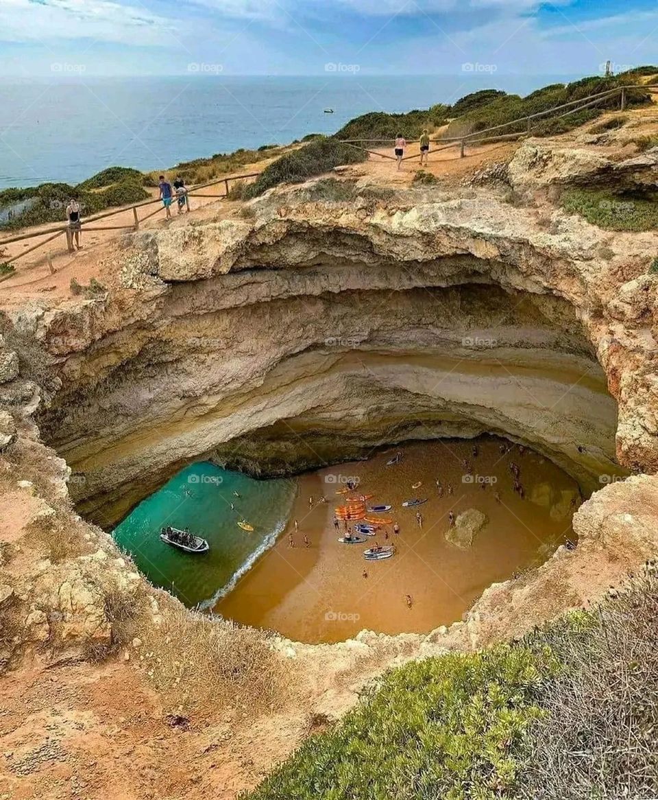 A beach hidden inside a crater in the earth ♥