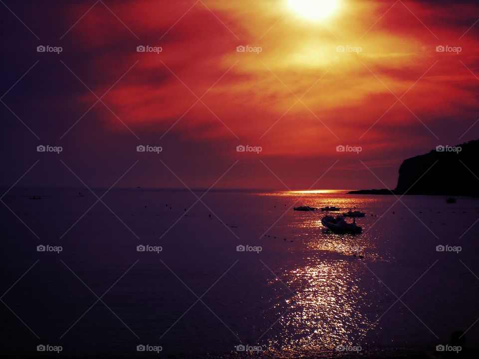 Scenic view of sea against dramatic sky