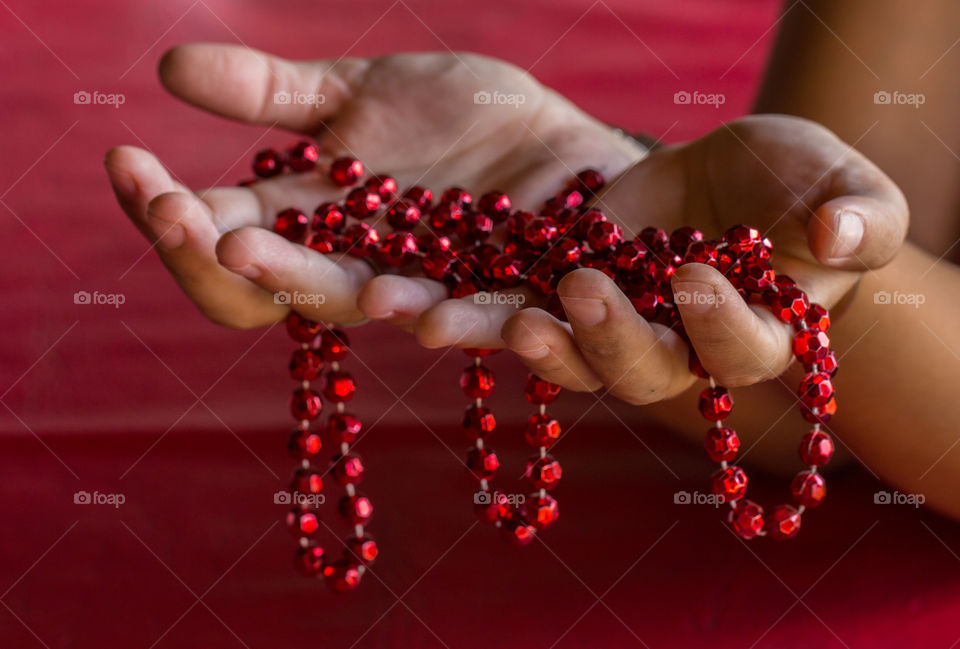 women hanging red necklace