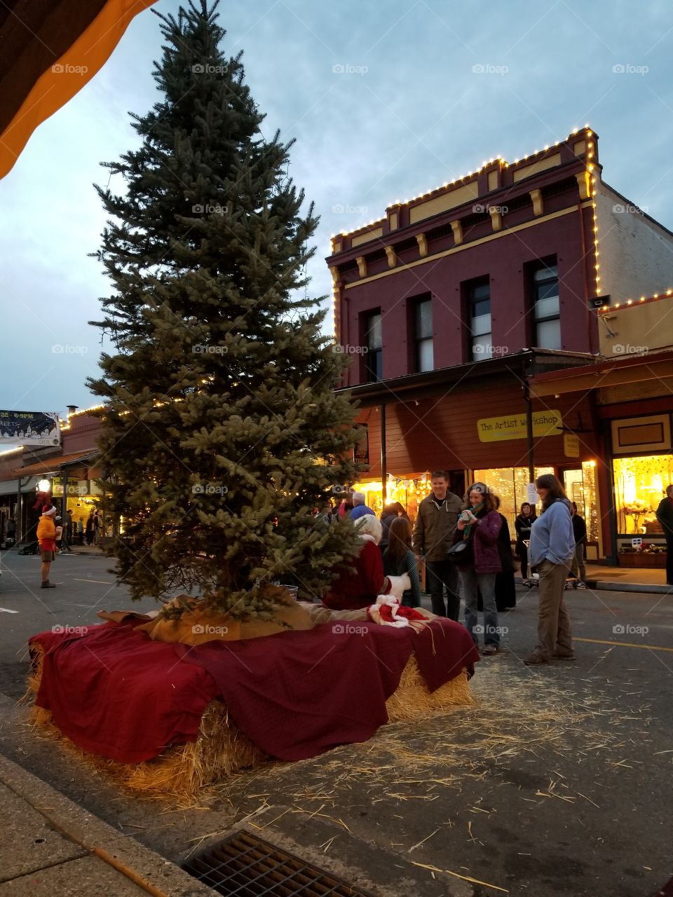 Meeting with Santa under the Christmas tree in an old town just seems so perfect