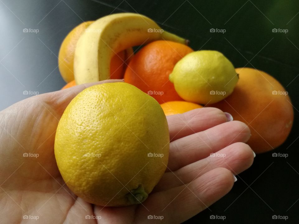 lemon holding in hand
