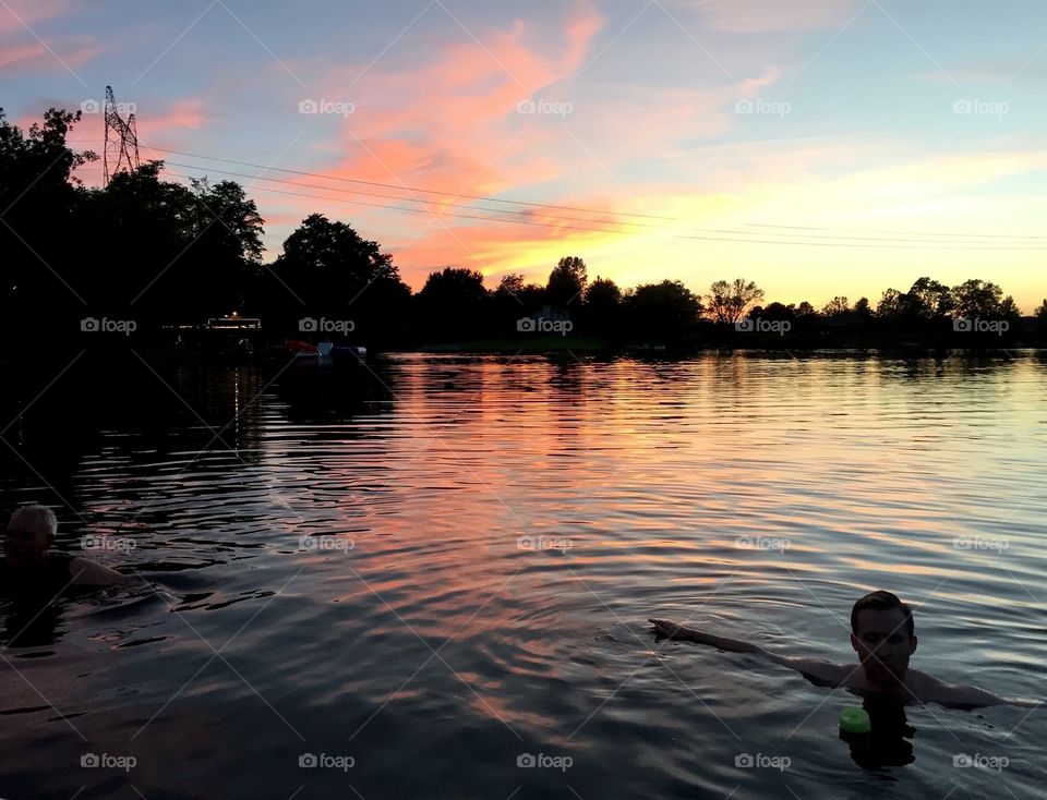 Swimming at sunset in Lake Waynoka in Ohio. We docked our boat and just swam in the clean fresh water for hours. Amazing night!
