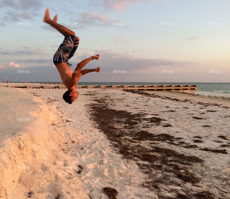 Back Flipping . Back flipping at the beach.