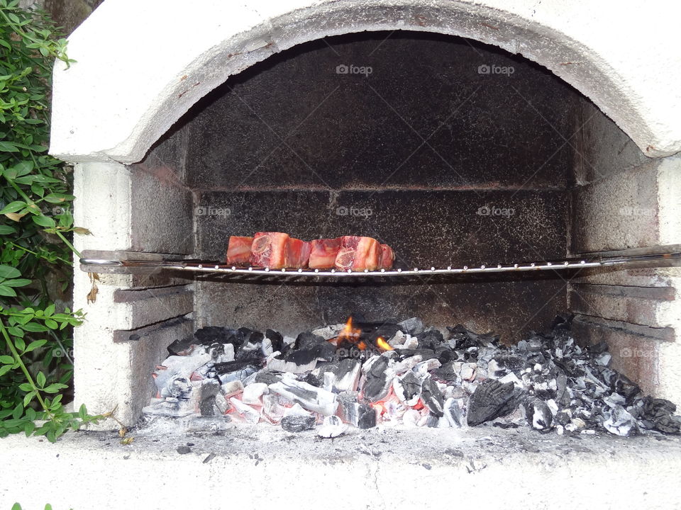 Hot Coals. Summer barbecue. The bright summer light enhancing the feel of heat.