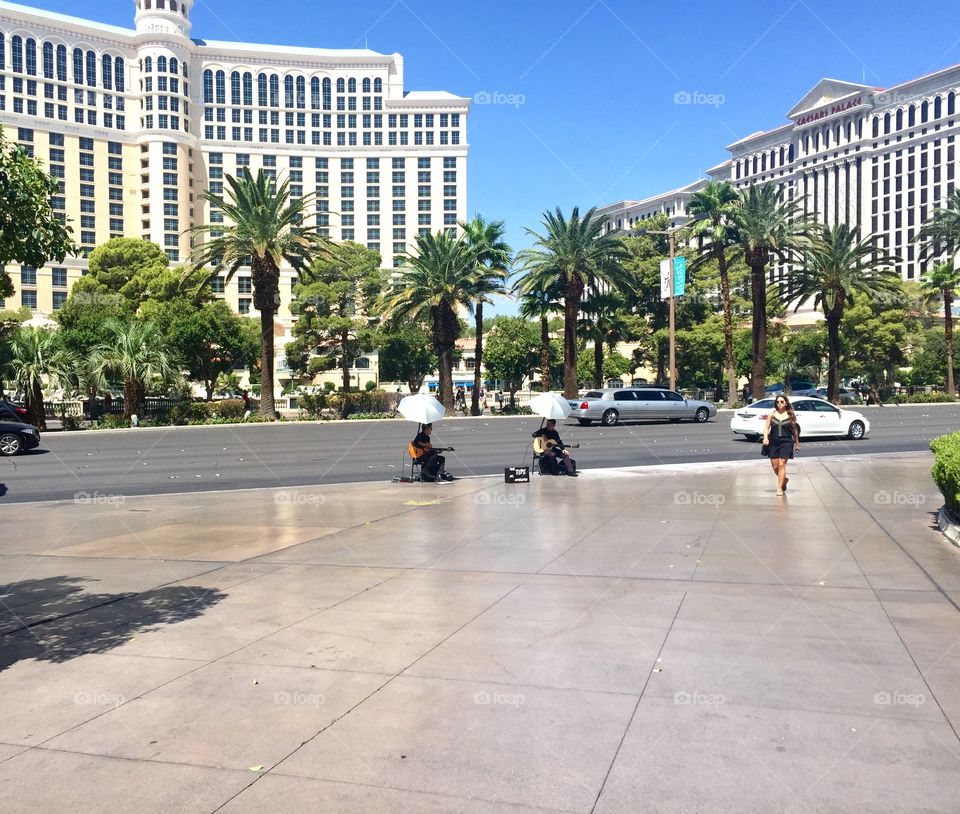 Woman walking on sidewalk in city