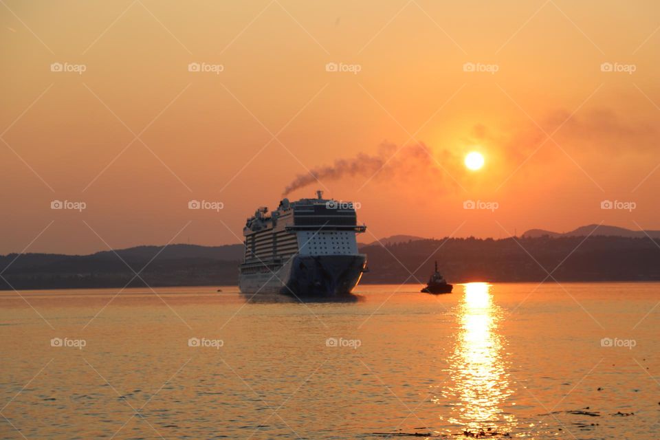 Big ship coming on sunset 