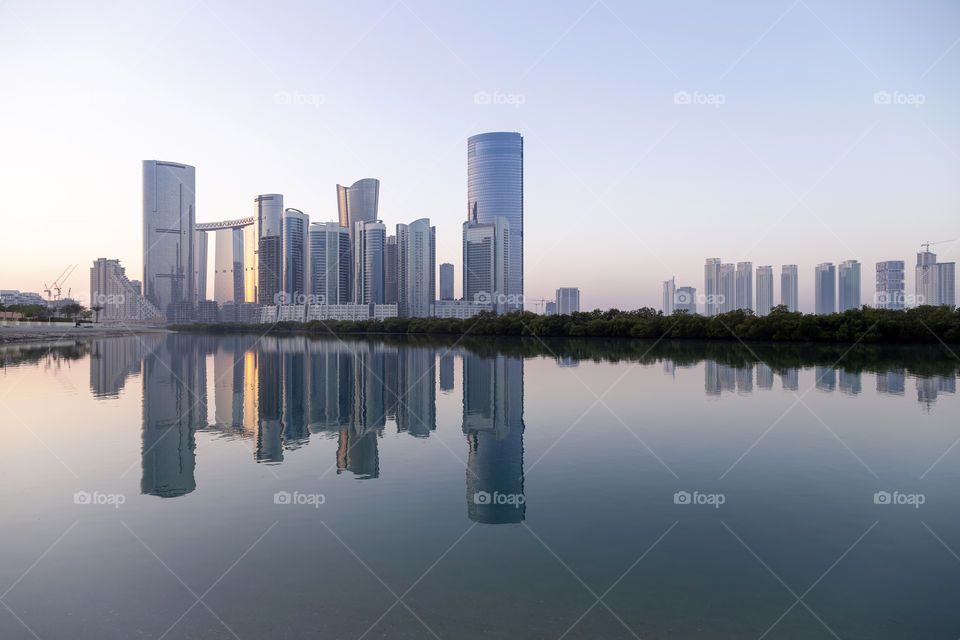 Peaceful morning at Al Reem island with reflection in the sea