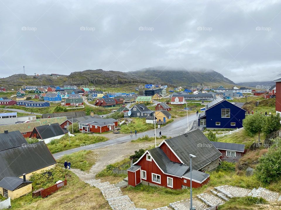 A small town in Greenland filled with brightly painted houses 
