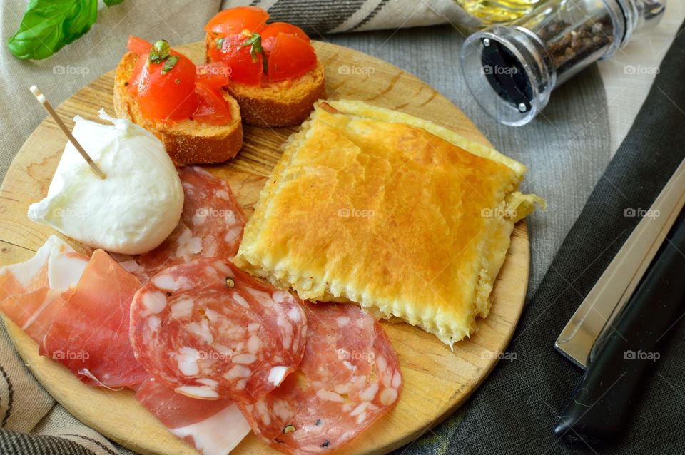 appetizer with salami, bruschetta tomato, pizza, provenance Italian