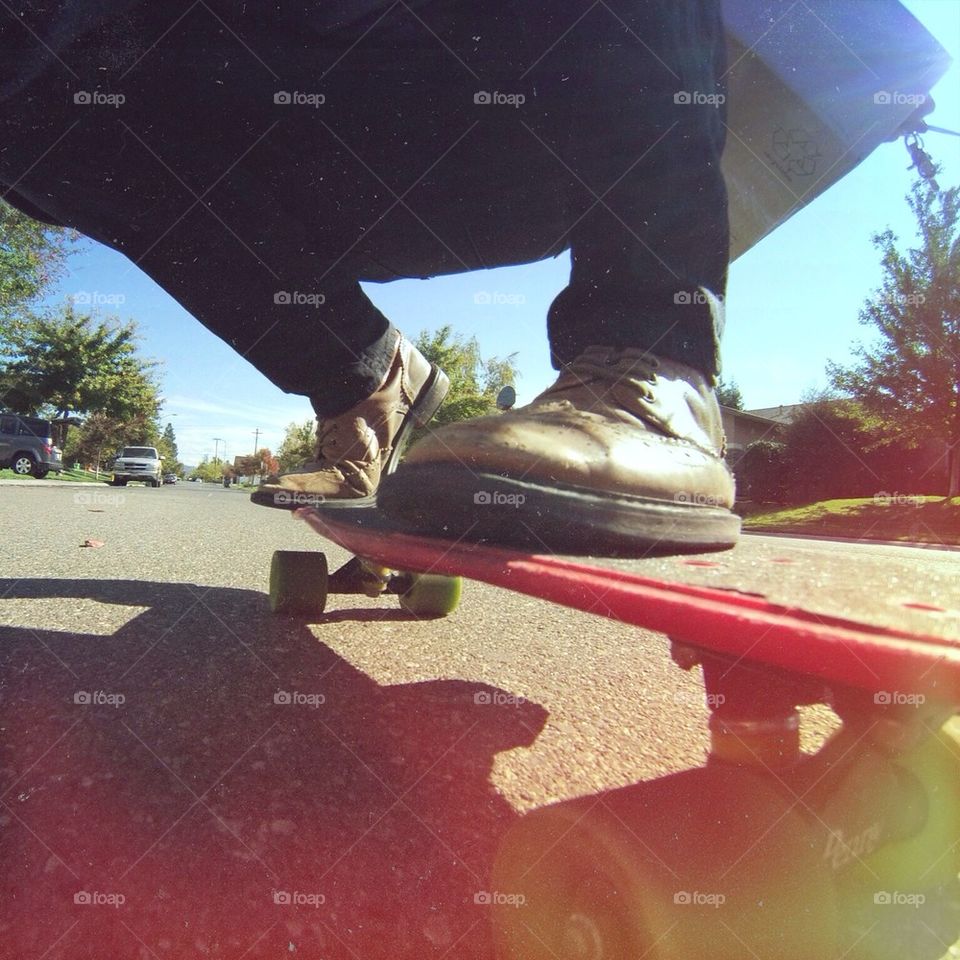Cruisin on a plastic skateboard