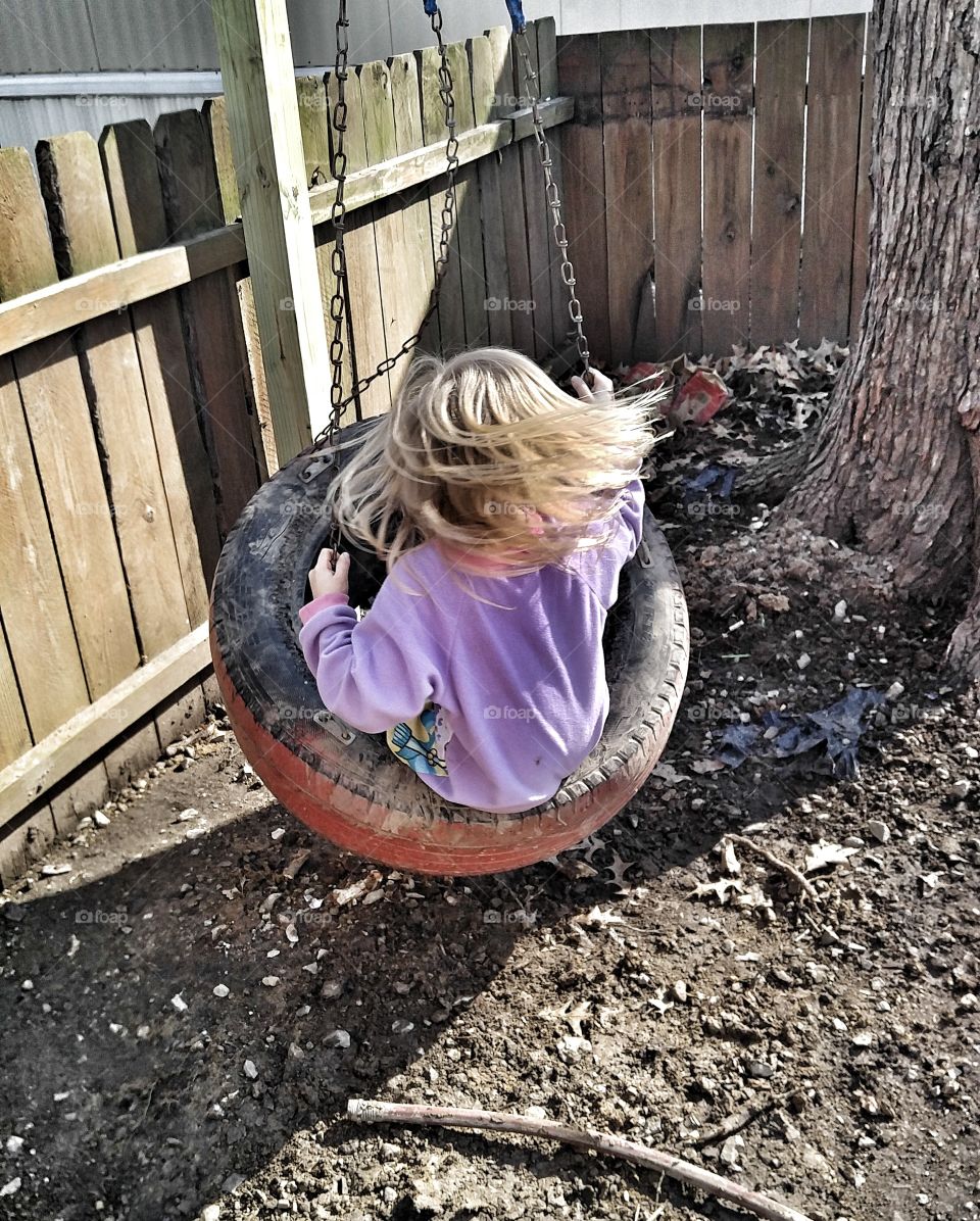 Little Girl on a Tire Swing, Outdoor Play, Childhood Memories