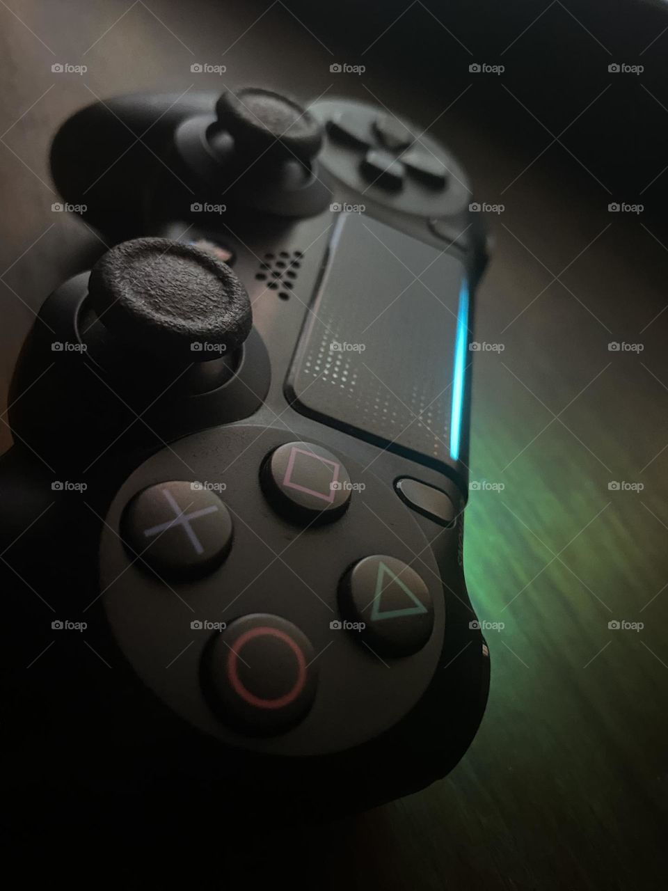 PS 4 black controller with pink light while playing games