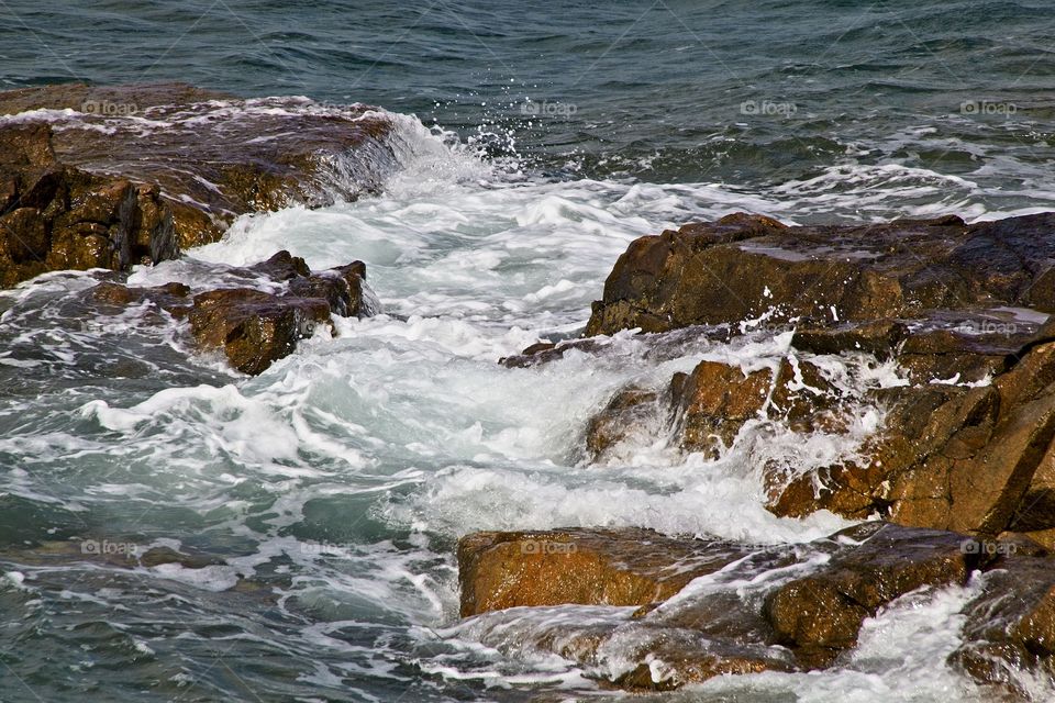 waves crashing on rocks