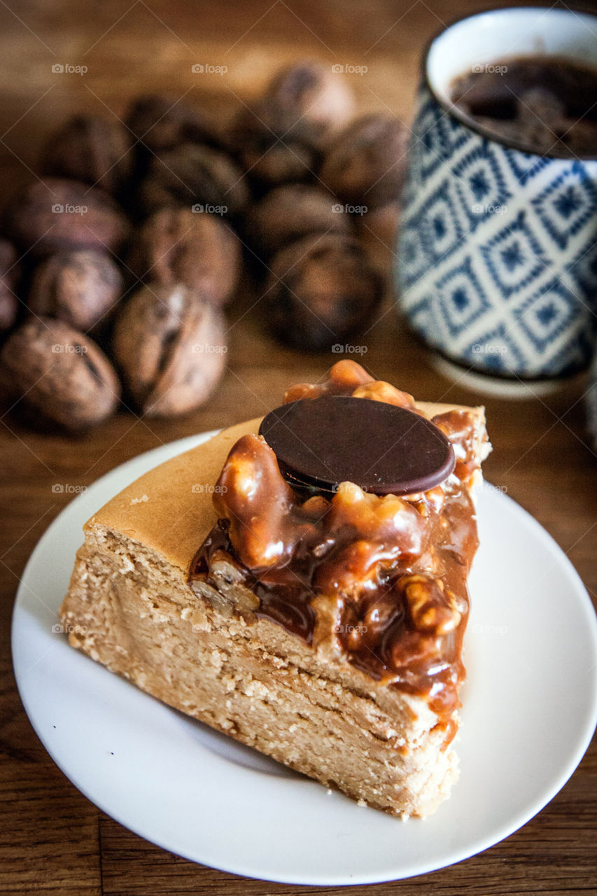 Close-up of cake slice with coffee bean