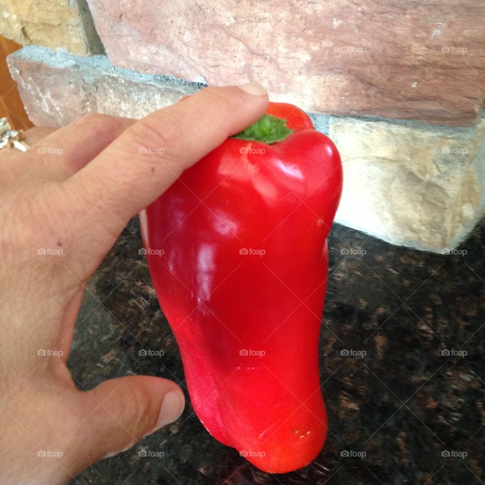 Holding red pepper 