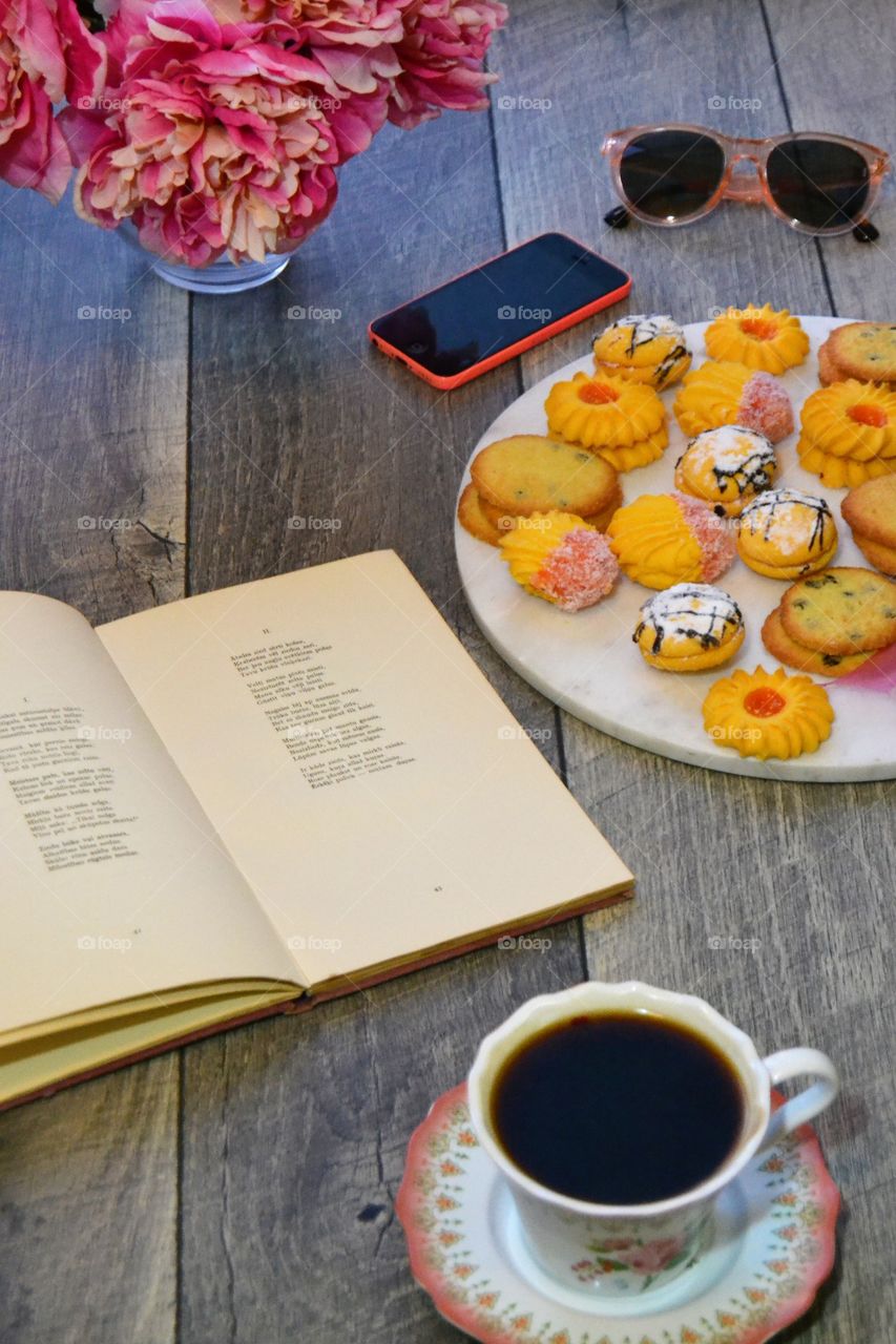 Coffee break with cookies and a book 