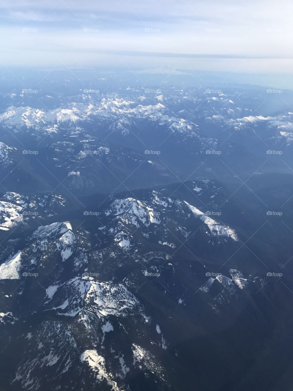 It's a very foggy morning and in the mountains on the way to camp taken from a helicopter.