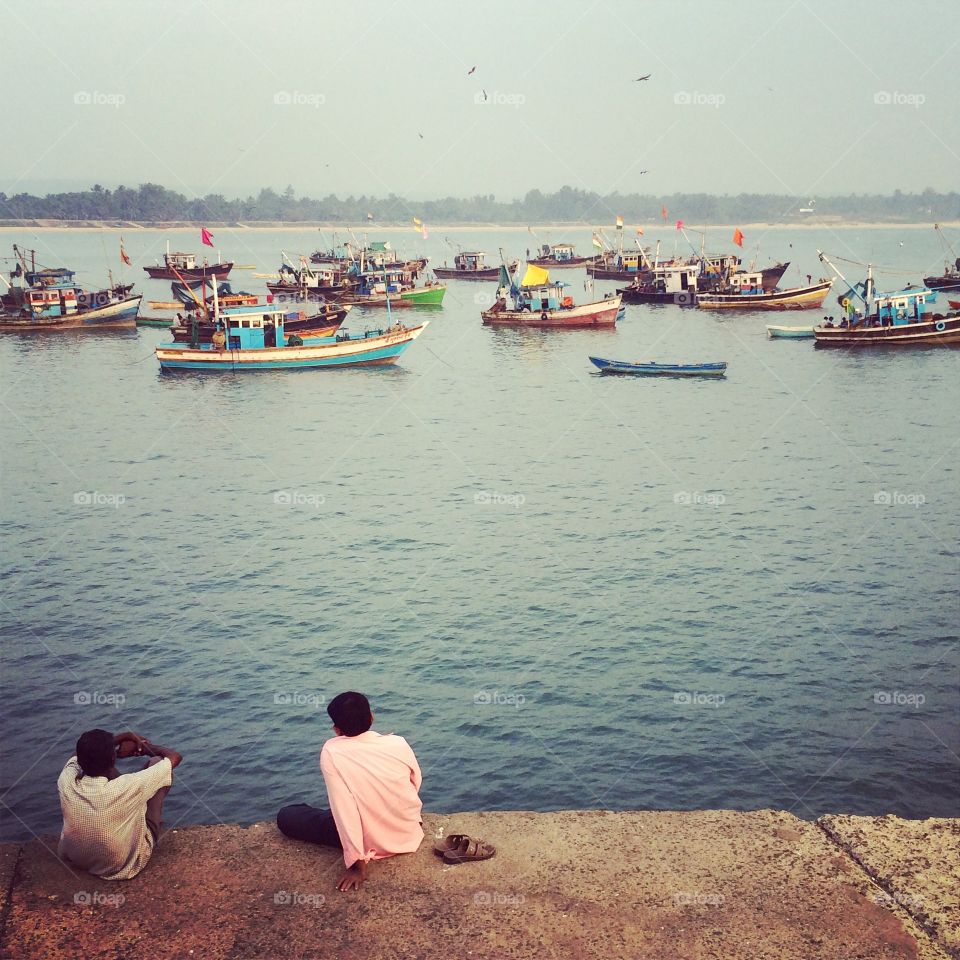 Seize a moment. Indians are watching the boats