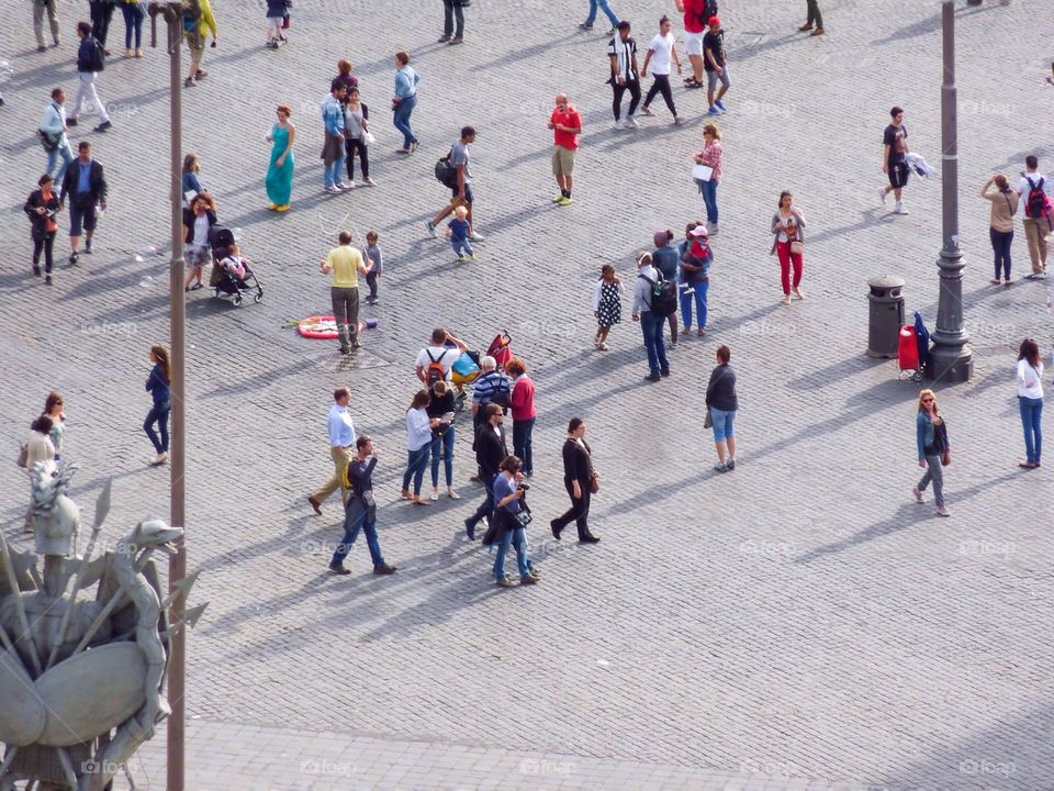 Tourists and Locals. Passers by at Piazza del Popolo. Rome