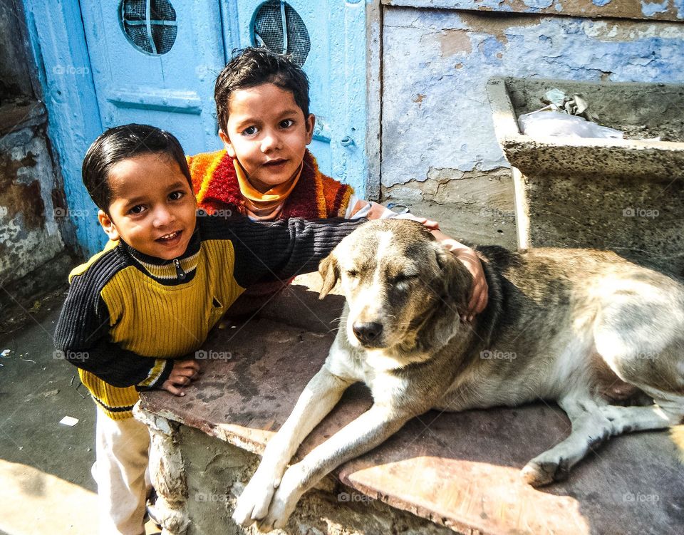 Friends. I came across these two boys and their pet dog in Old Delhi.
