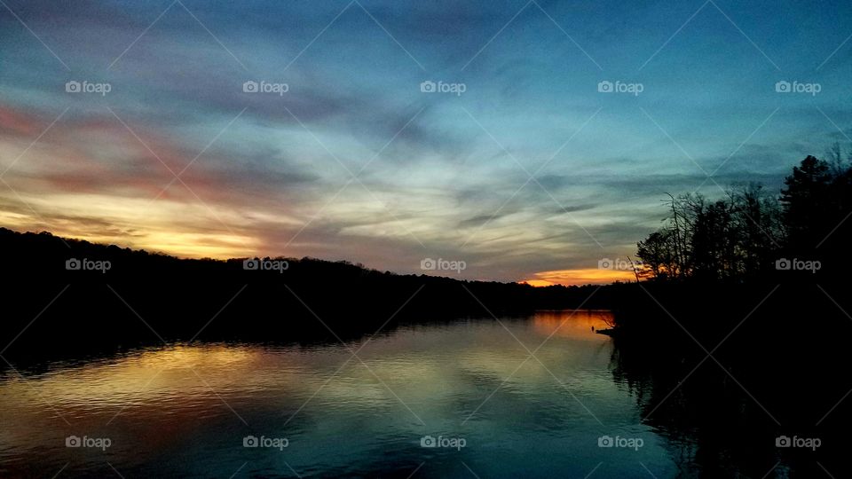 reflections of dusk on the lake.