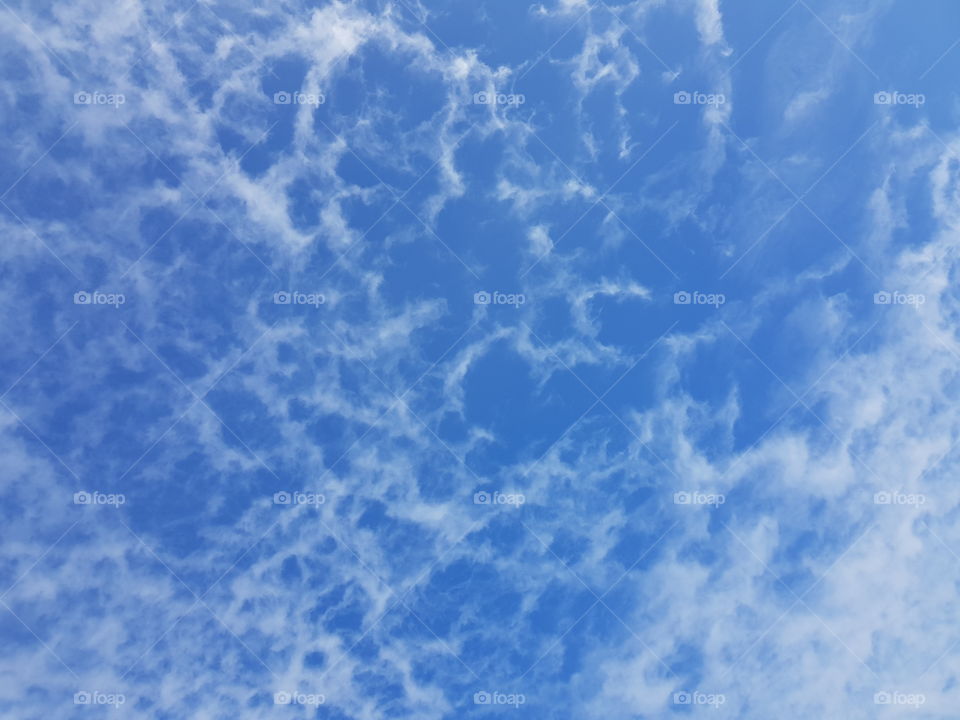 Blue sky and fluffy clouds