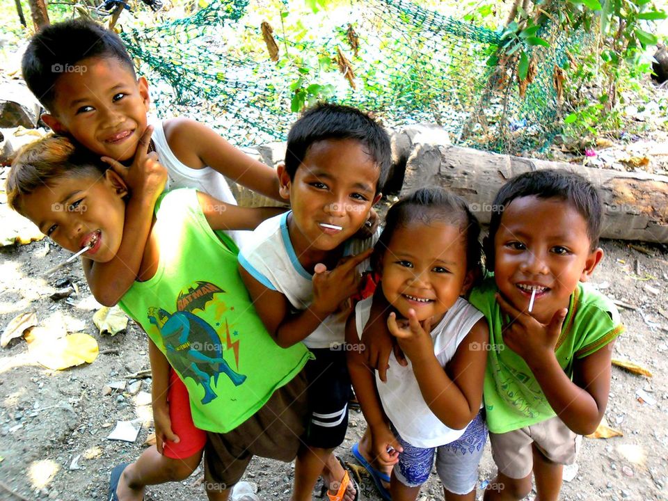 young asian kids smiling at the camera