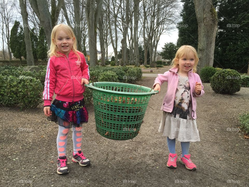 Two sisters helping with gardening in Lund Sweden.