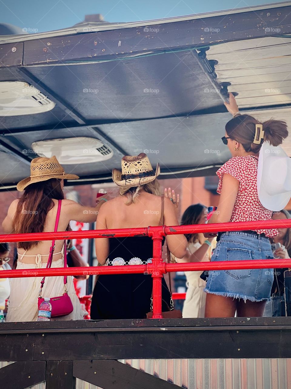 Girls weekend party in Nashville, United States. Women riding a party bus enjoy the revelry on lower Broadway!