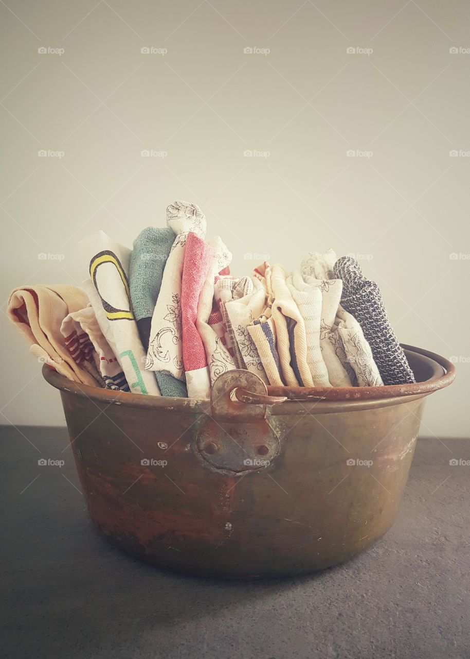 laundry kitchen cleaning cloths in copper tub