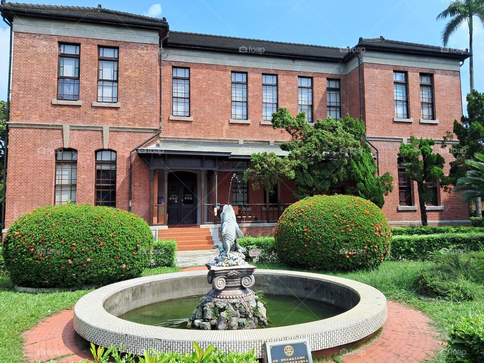red brick building in summer