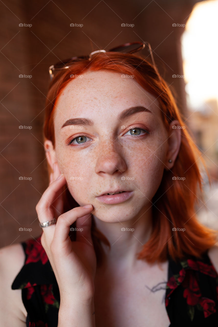 portrait photo of a young woman with bright makeup