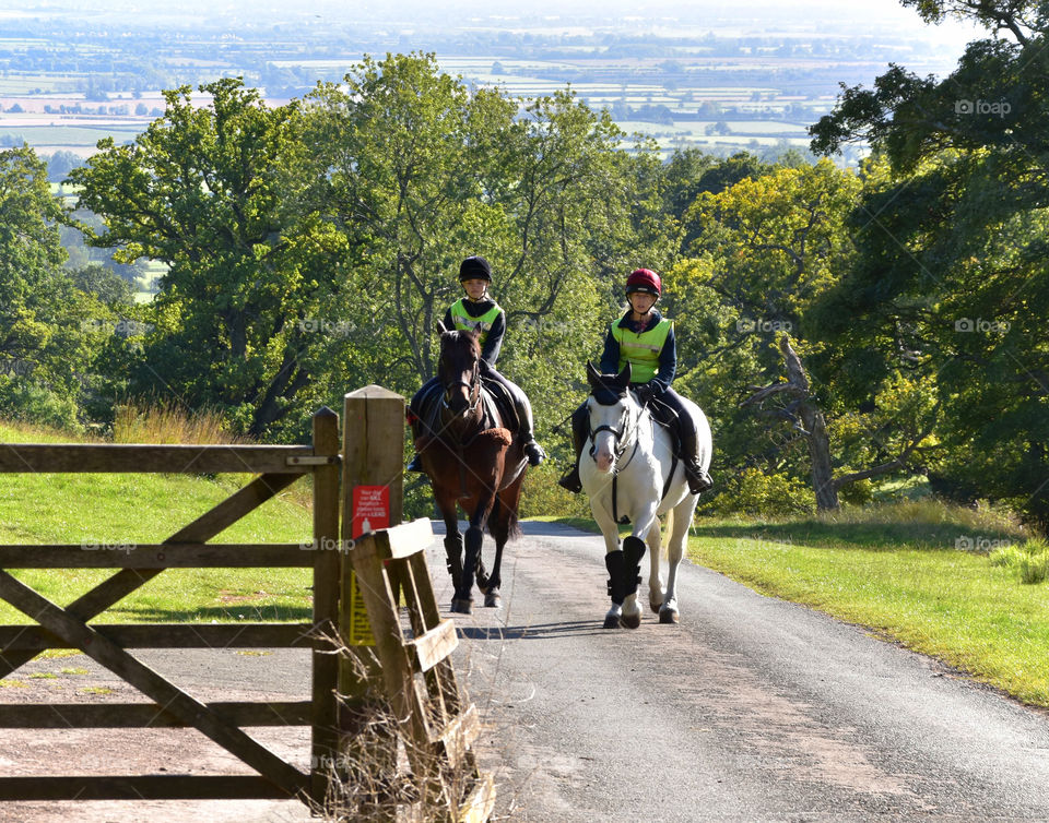 Two horse riders in English countryside 