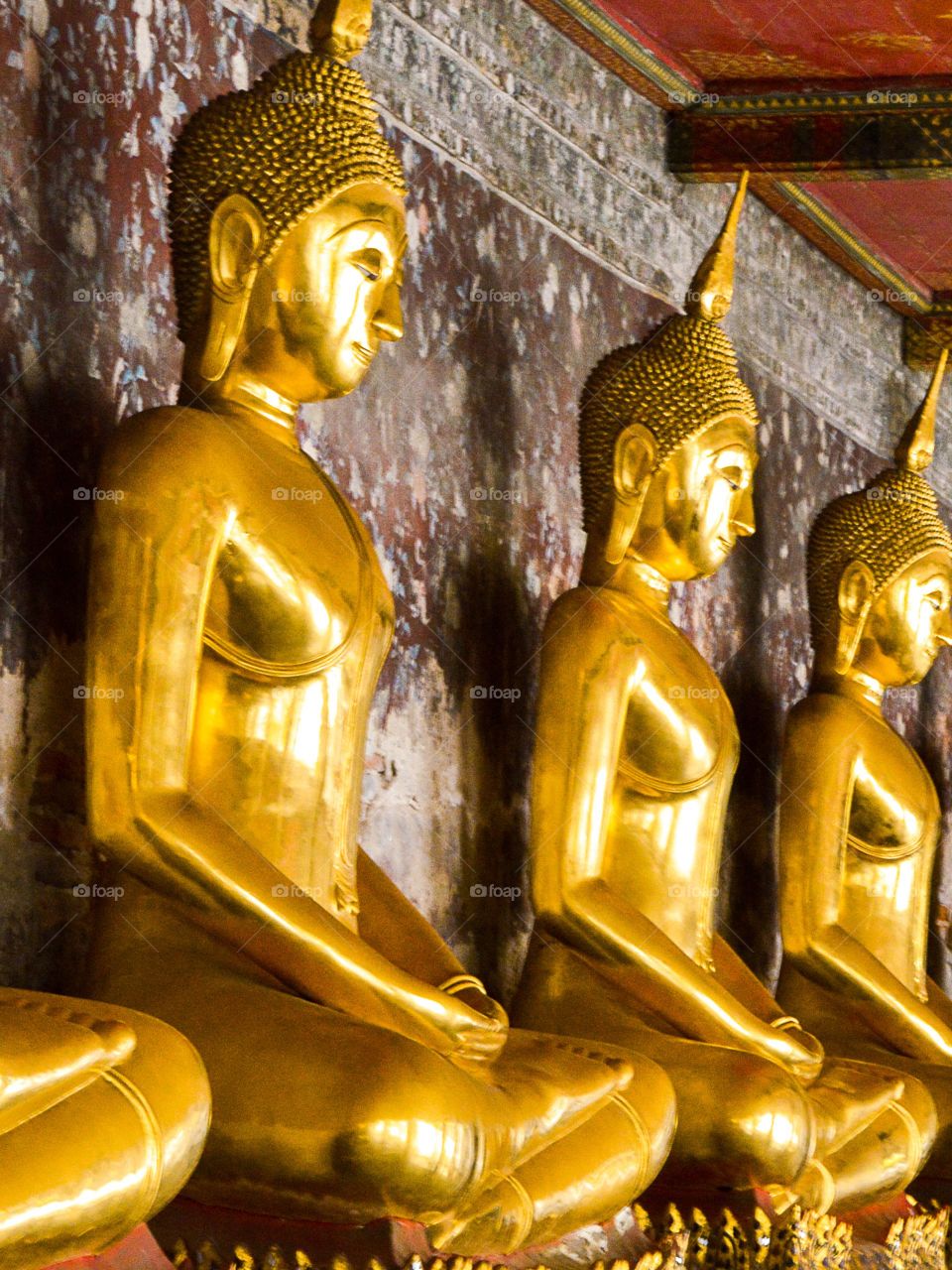 buddha statue. gold buddha statue in garden