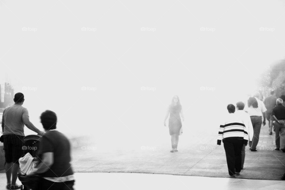 Mysterious woman coming out from the fog