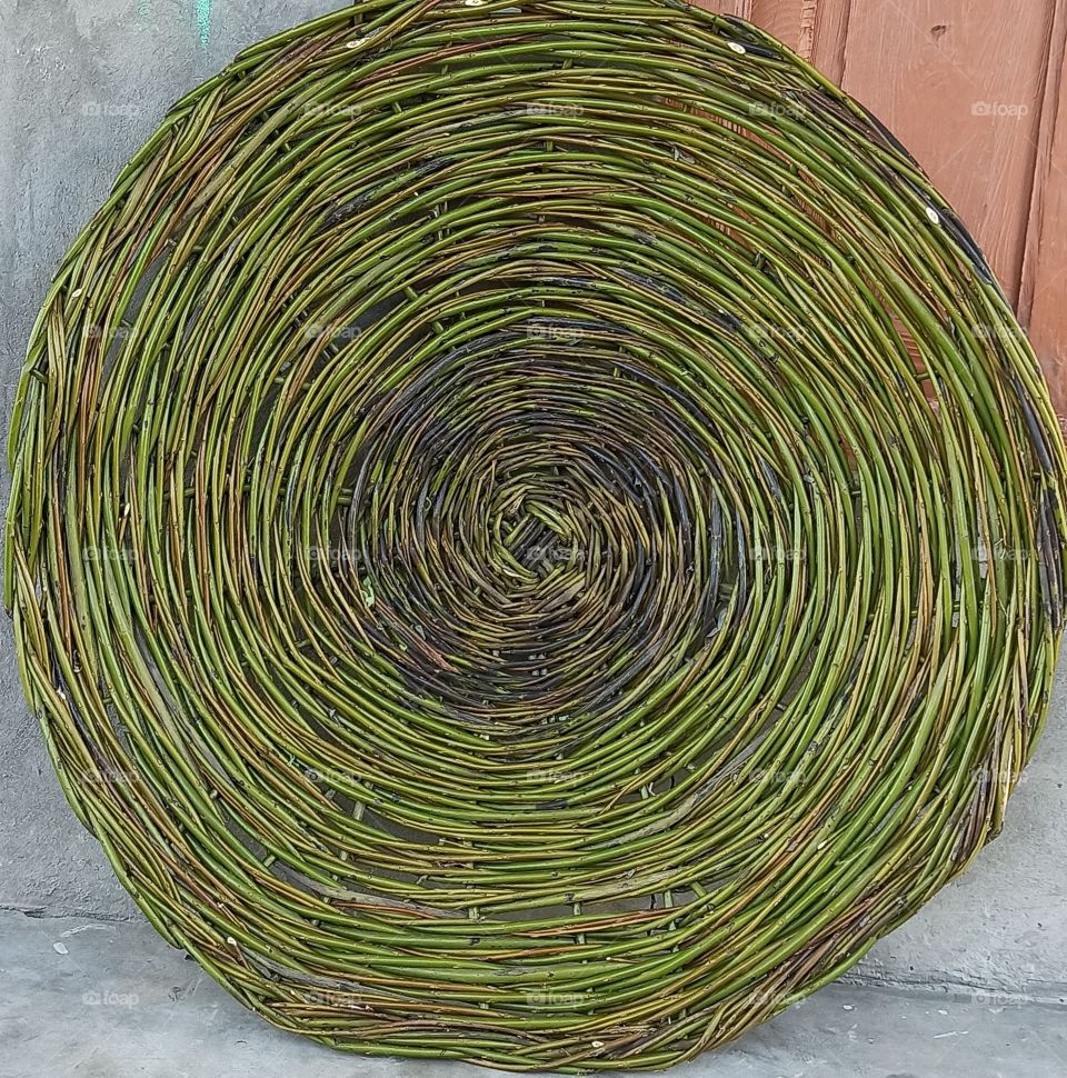 Home made item made of willow trees' branches used in some Rural parts of Kashmir Valley in Jammu & Kashmir India. This item is used for drying Green Vegitables during hot Summer & later used for cooking during Harsh Snowy Winter days in Kashmir