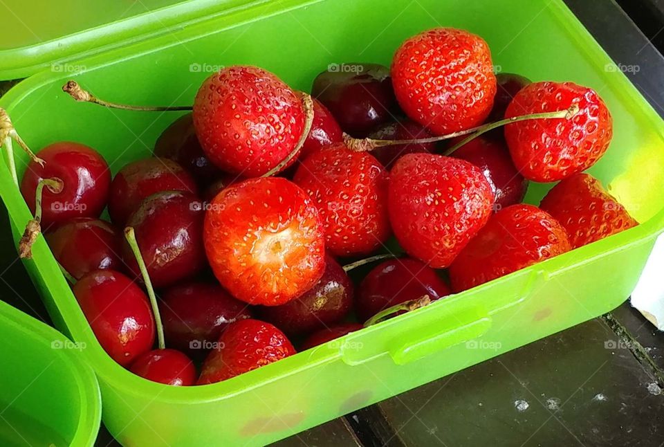 Fresh strawberries and cherries
