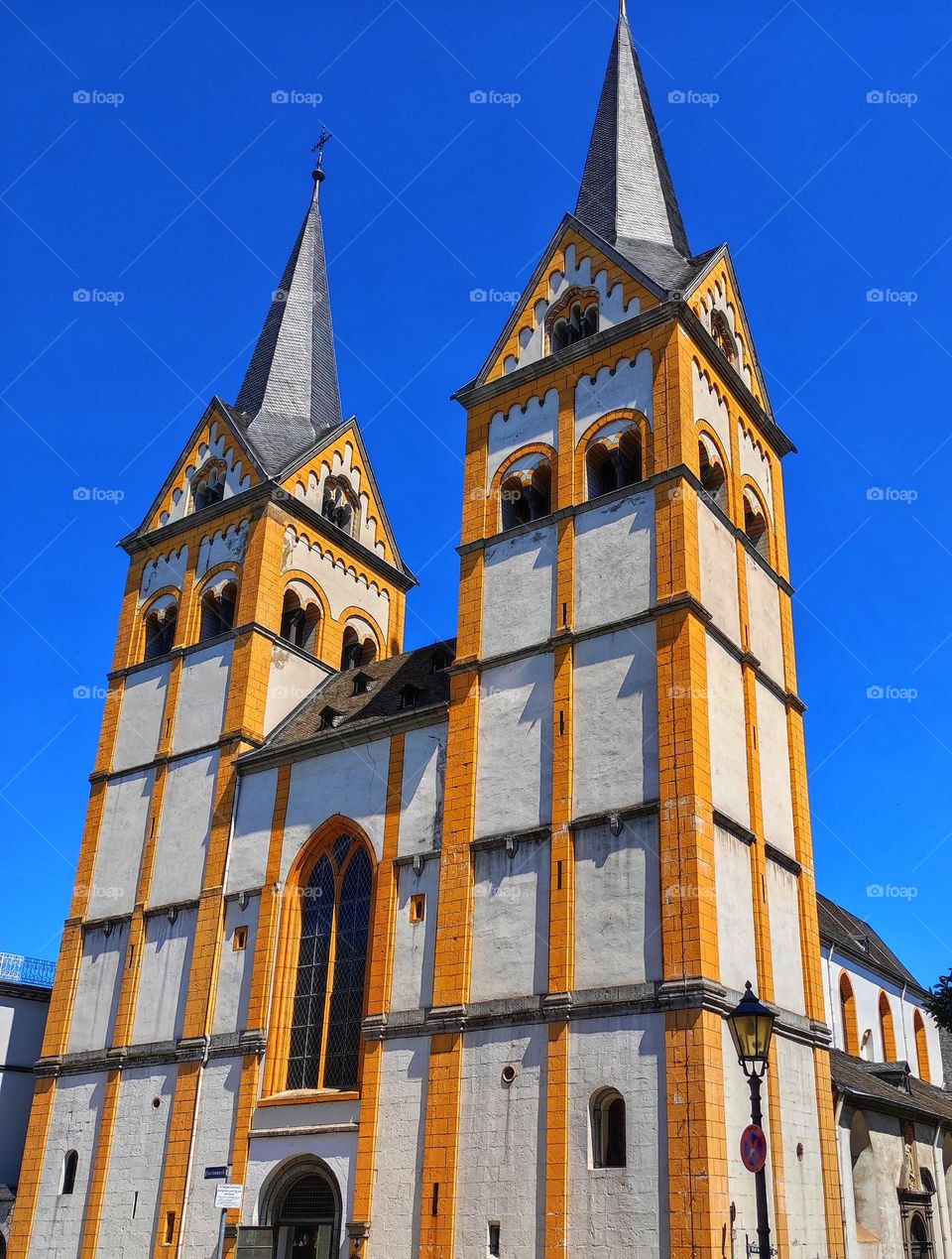 A beautiful old church in Germany in white and yellow colours with clear blue skies, amazing architecture in a small town with beautiful colours