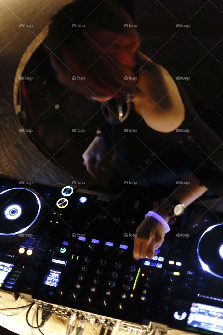 shot of Dj mixing platines from above
