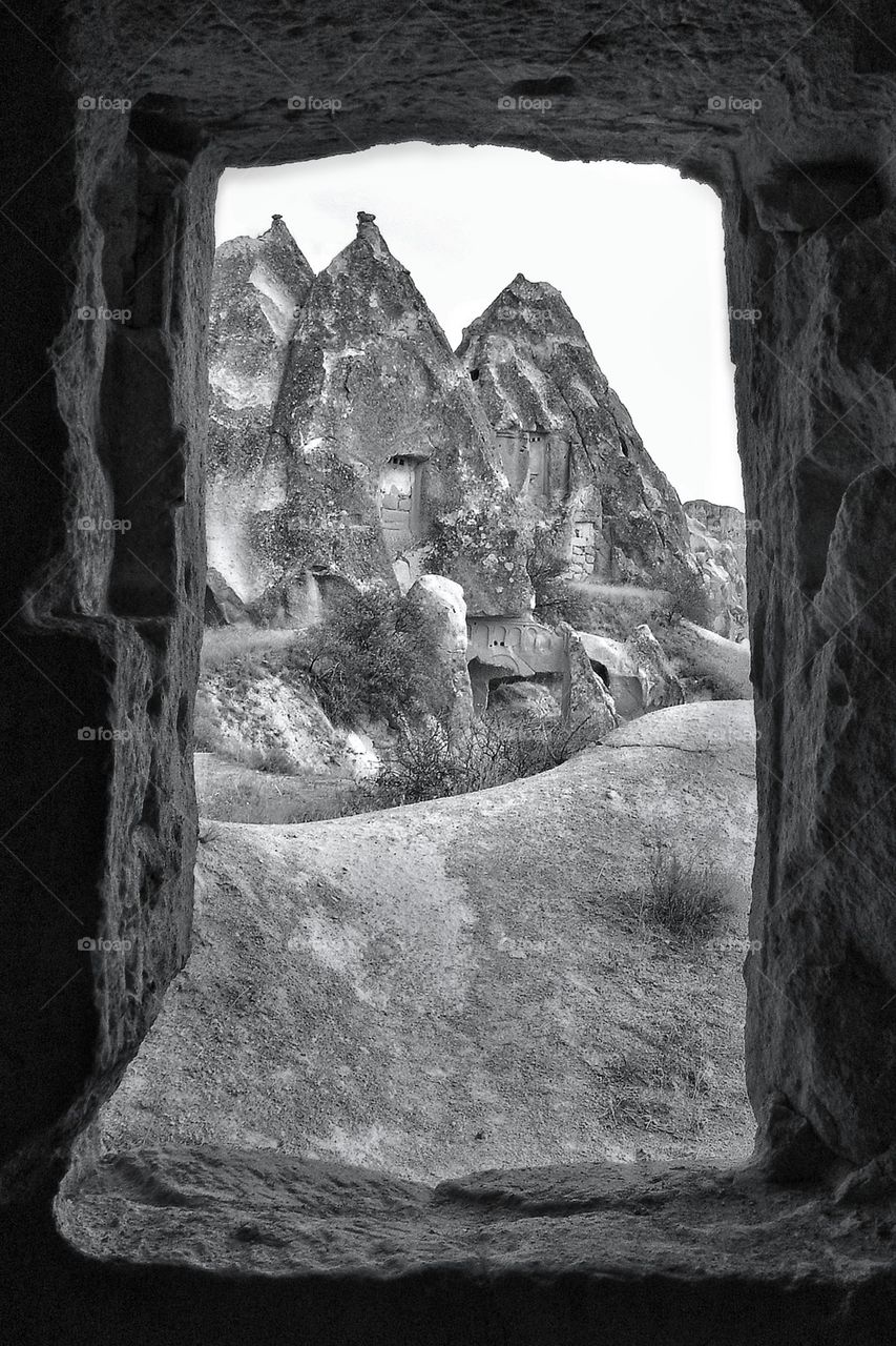 View of rocky mountain through window