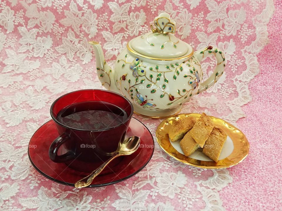 Almond Biscotti on a golden plate, served with tea